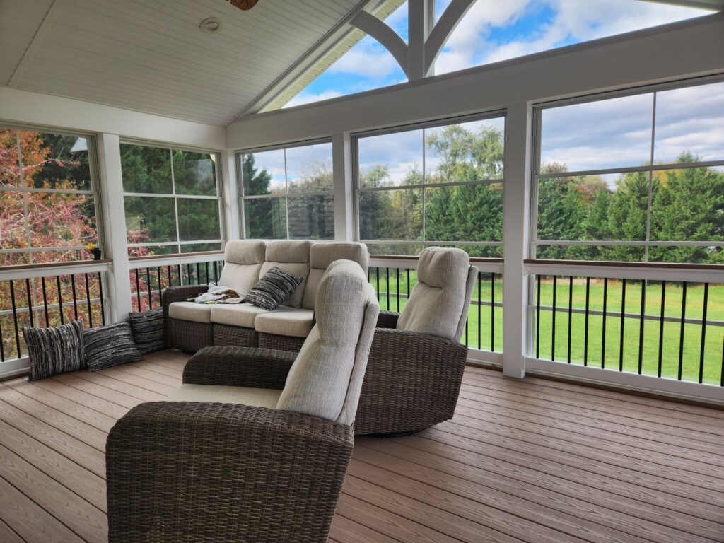 inside a covered deck with comfy seating