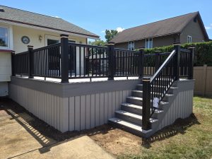 Timbertech PVC Slate Gray deck with Castle Gate border, matching skirting, black Radiance railings with cap lights, step lights &#8211; Warminster PA