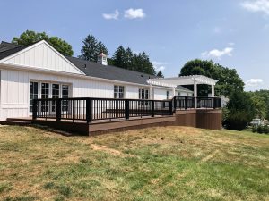 Timbertech PVC Mahogany deck with black Radiance rails and white vinyl Pergola &#8211; Berwyn PA