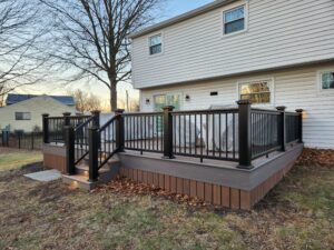 Timbertech PVC English Walnut deck with a dark Hickory border, Timbertech  railing system with cap lights – Warrington PA