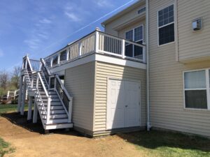 Timbertech PVC deck with white vinyl trim & railings, storge shed built in under deck – Chester Springs PA
