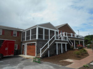 A-frame roof with siding gable, screen room over deck, garage under deck – Myerstown PA