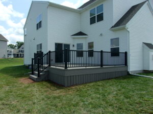 Timbertech PVC Coastline deck with matching skirting around the bottom, black American series railing – Gilbertsville PA