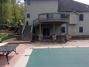 Azek Weathered Teak deck with matching custom railings, curved front and covered posts & beams – Harrisburg PA