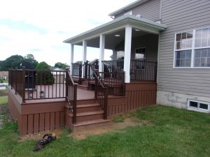 Porch style roof over an Azek Morado deck with American series Speckled Walnut railings – Harrisburg PA
