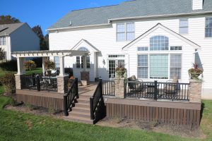 Almond Vinyl Pergola with stone columns and extra wide shade slats – West Chester PA