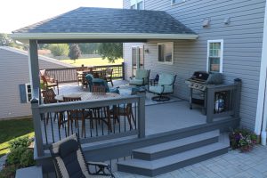 Hip-style roof over Azek Slate Gray deck with Island Oak border – Cochranville PA
